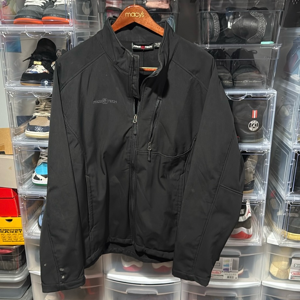 Black men’s heavyweight jacket size 3XL chest zippered pocket two side pockets.
